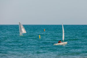 Boats on the water at Felpham beach, Bognor Regis. 20th June 2022.