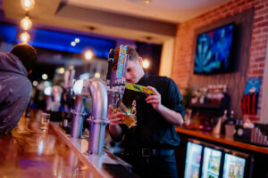 Man pouring pint in Rocks Bar Bognor REgis